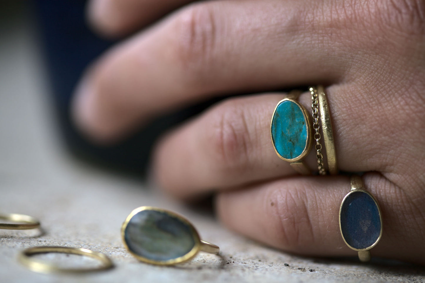 Collection of handmade recycled gold rings with precious stones