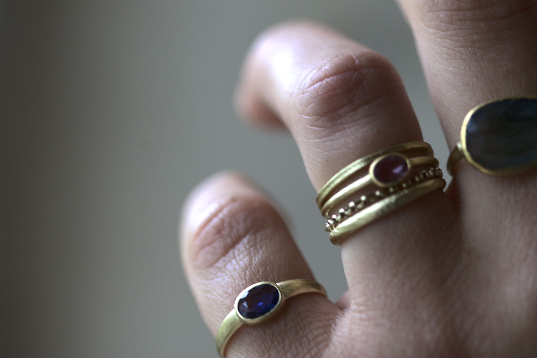 Close up of recycled gold rings with precious stones
