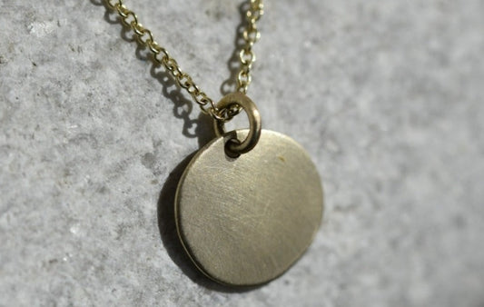 Pure hand hammered, 9 carat disc pendant